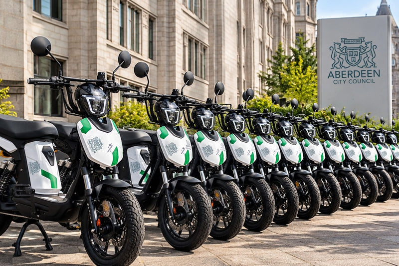 A row of Aberdeen City Council-liveried Eskuta SX-250s outside a council building