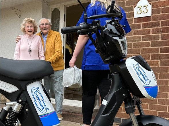 A Caremark care worker arriving at a home visit on an Eskuta SX-250