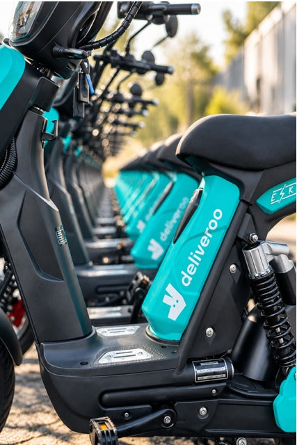A row of Eskuta SX-250s in teal Deliveroo livery