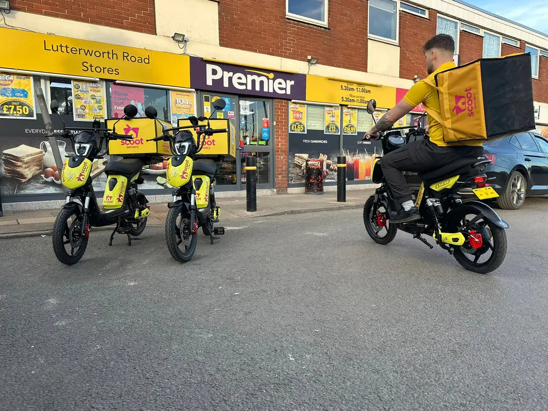 A delivery rider setting off from a convenience store on a liveried Eskuta SX-250