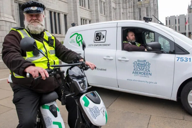 Aberdeen City Council wardens on Eskuta SX-250 eBikes beside an ANPR enforcement van
